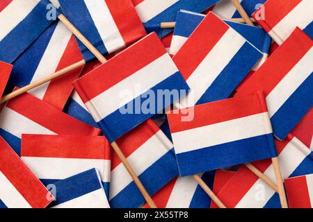 Miniature Dutch paper flags close up full frame as background Stock Photo