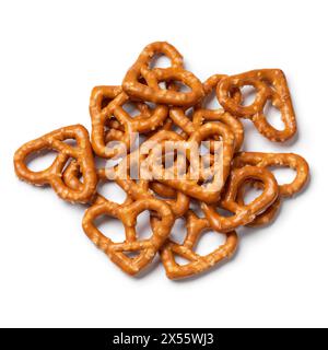 Heap of heart shaped pretzels isolated on white background close up Stock Photo