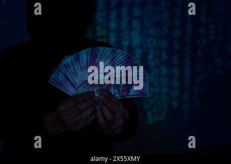 Male hacker use computer laptop hacking a personal data. Cyber threat defense. Stock Photo