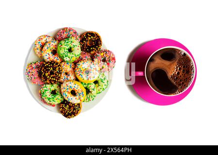 Multicolored donuts on a white plate and a red cup of coffee on a white background Stock Photo