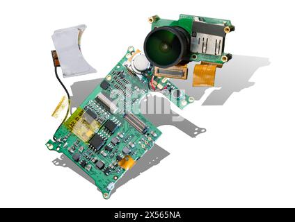 Electronic parts of sports cameras on white background with shadow. Printed circuit board and wide-angle fisheye lens Stock Photo
