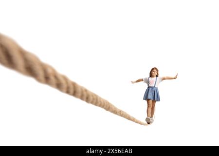 Child walking on a tightrope isolated on white background Stock Photo