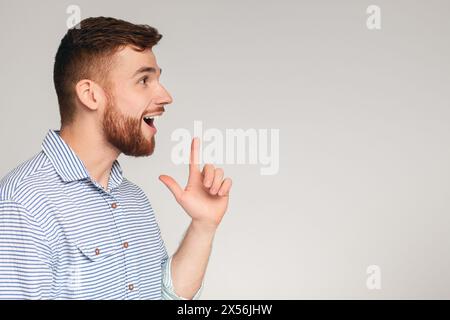 Young excited man having good idea and feeling happy Stock Photo