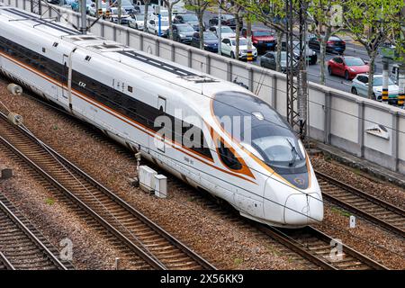 Shanghai, China - April 11, 2024: China Railway CR High-speed Train Of The Type Fuxing CR400 Train In Shanghai, China. Stock Photo