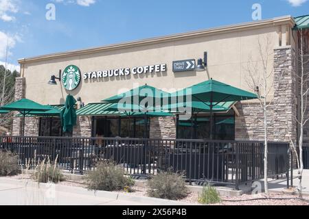 Exteriors of modern Starbucks coffee locations with drive thru windows, located in shopping centers. Stock Photo