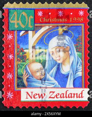 Cancelled postage stamp printed by New Zealand, that shows Mary and Child, Christmas, circa 1998. Stock Photo