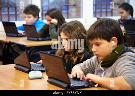 11 year old pupils using laptop computers, 5º de ESO, Ikastola Zurriola, San Sebastian, Guipuzcoa, Basque Country, Spain Stock Photo