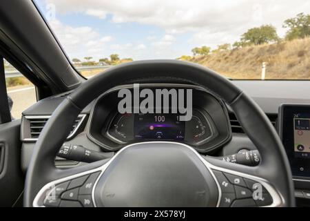 Driver view to the speedometer at 100 kmh. Driver POV to car dashboard. Stock Photo
