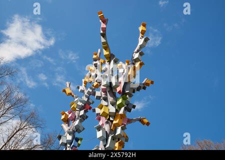 Bird houses on a tree against the sky. Wooden birdhouses, nesting boxes in Esplanade park, Riga, Latvia. Stock Photo