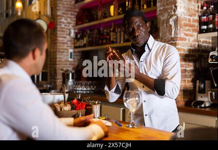 Bartender making cocktail Stock Photo