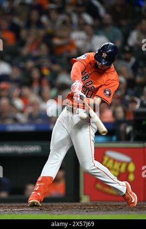 Houston Astros' Kyle Tucker, left, scores as Seattle Mariners catcher ...