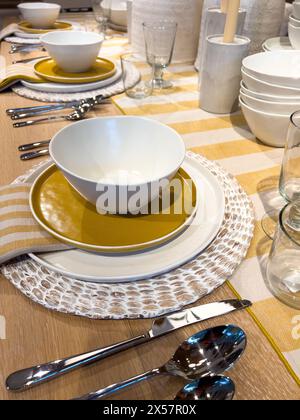 Elegant Dining Table Setting with Modern Tableware Stock Photo