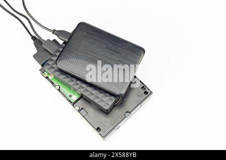 External hard disc drives connected to transfer files isolated on white background Stock Photo