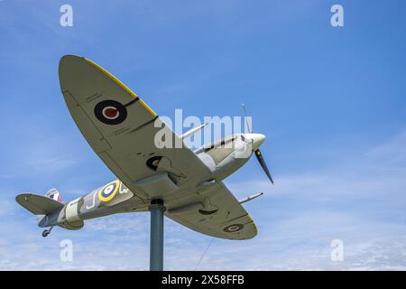 A replica Spitfire fighter aircraft from WW2 pictured on the edge of Fairhaven Lake in Lytham, Lancashire on 5 May 2024. Stock Photo