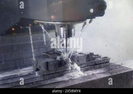 Auto CNC turning with robot drill milling factory with water coolant streams. Industry Stock Photo