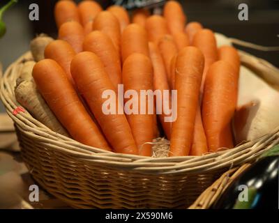 Basket of carrots on display for sale at the market Stock Photo