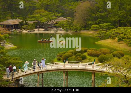 Japan, Shikoku, Takamatsu, Ritsurin-koen, garden, bridge, people, Stock Photo