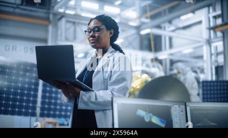 Portrait of Brilliant Female Engineer Confident and Focused Thinking, working at Aerospace Satellite Manufacturing Facility. Top World Scientist Doing Science and Technology Research in Space Program Stock Photo