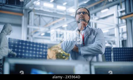 Portrait of Mature Male Engineer Confident and Focused Thinking, working at Aerospace Satellite Manufacturing Facility. Top World Scientists Doing Science and Technology Research in Space Program Stock Photo