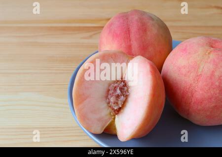 Delectable Fresh Ripe Peach Showing Its Juicy Flesh Stock Photo