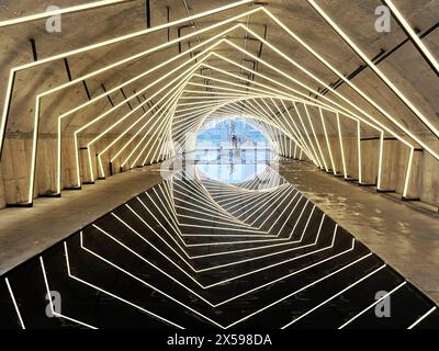 Chongqing, China. 08th May, 2024. The Sandongqiao Bridge in Chongqing, China, is glowing with colorful neon lights on May 5, 2024, creating a reflection in the water that makes it feel like you are traveling through a time tunnel. (Photo by Costfoto/NurPhoto) Credit: NurPhoto SRL/Alamy Live News Stock Photo