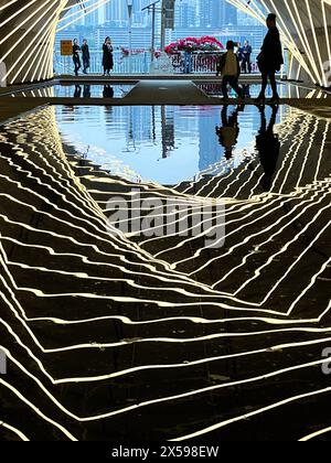 Chongqing, China. 08th May, 2024. The Sandongqiao Bridge in Chongqing, China, is glowing with colorful neon lights on May 5, 2024, creating a reflection in the water that makes it feel like you are traveling through a time tunnel. (Photo by Costfoto/NurPhoto) Credit: NurPhoto SRL/Alamy Live News Stock Photo