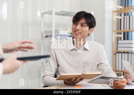 Close up ux developer and ui designer brainstorming interface wireframe design.Creative digital development agency Stock Photo