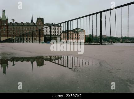View of a railing in front of buildings Stock Photo