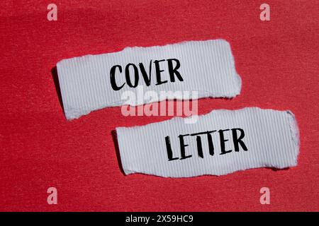 Cover letter words written on ripped white paper pieces with red background. Conceptual cover letter symbol. Copy space. Stock Photo
