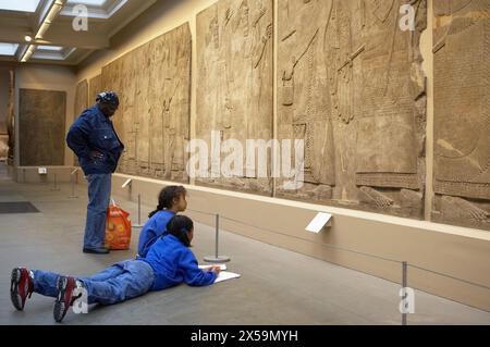Stone panel from the Palace of Ashurnasirpal II, Nimrud Palace Reliefs, The British Museum, London. England. UK. Stock Photo