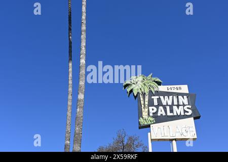 WHITTIER, CALIFORNIA - 28 APR 2024: Twin Palms Village sign at the retro strip mall on Whittier Boulevard. Stock Photo