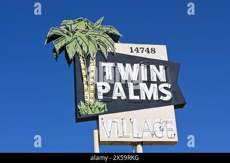 WHITTIER, CALIFORNIA - 28 APR 2024: Twin Palms Village sign at the retro strip mall on Whittier Boulevard. Stock Photo