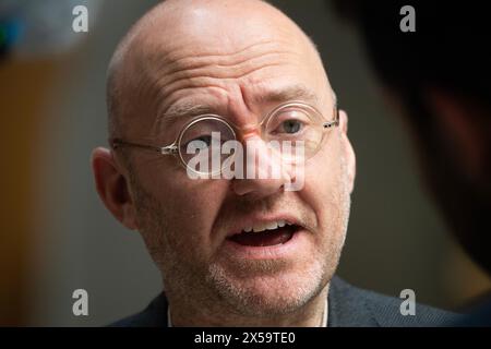 Edinburgh, Scotland, UK. 8th May, 2024. PICTURED: Patrick Harvie MSP, Scottish Green Party Co-Leader. On the day that the new Scottish First Minister, John Swinney MSP, is sworn in and announcing his new cabinet, scenes inside the Scottish Parliament at Holyrood where parliamentary members give their reactions to the unfolding news. Credit: Colin D Fisher Credit: Colin Fisher/Alamy Live News Stock Photo