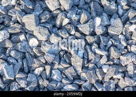 Natural background, wallpaper. Pebble stone floor top view. Small gray stones. Texture. Gray dry pebble. Above, up. No people, nobody. Gravel. Stock Photo