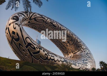 Dubai, UAE - January 16, 2024: Dubai museum of the Future from sheikh zayed road. Modern futuristic Museum built according designed by architect Shaun Killa. Cityscape skyline. Stock Photo