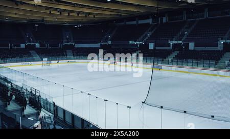 Empty Professional Ice Hockey Arena with Turned on Lights. Big Rink Stadium Ready for the Championship to Begin. Stock Photo