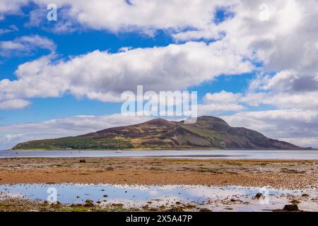 View across calm sea to Holy Island offshore from Lamlash, Isle of Arran, North Ayrshire, Strathclyde, Scotland, UK, Britain, Europe Stock Photo