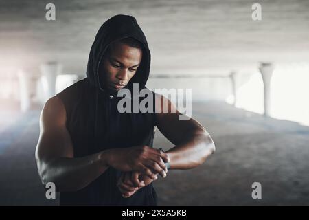 Black man, athlete and smart watch for running monitor in parking garage for heart rate, calories or cardio. Male person, wrist and checking for Stock Photo