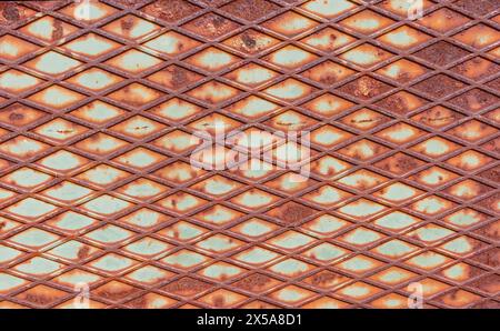Rusty grid metal texture with romboid background. Stock Photo