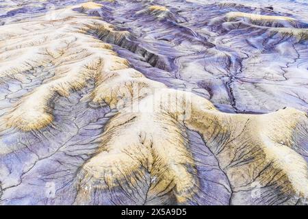 An aerial shot captures the ethereal textures of the desert landscape in Utah, showcasing intricate patterns and earthy tones. Stock Photo