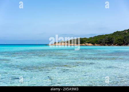 Pristine aqua waters and tranquil horizon of a Sardinian picturesque coast, showcasing unspoiled nature and Mediterranean serenity Stock Photo