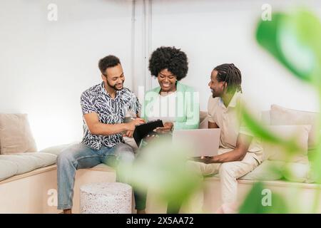 Diverse team collaborating on a project in a coworking space Stock Photo