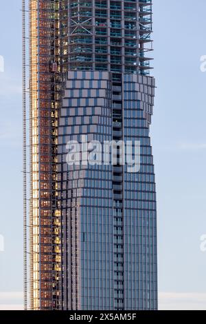 gothenburg, Sweden - Feb 04 2023: Construction of high rise building Karlatornet. Concrete frame half covered with windows. No visible people Stock Photo