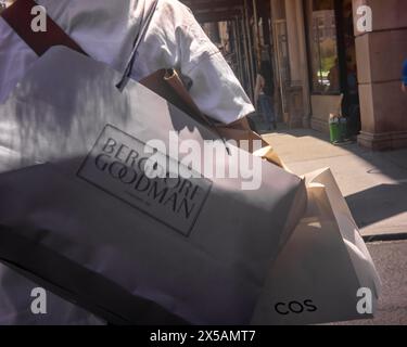 Shopper in the Union Square neighborhood of New York with her purchases from Bergdorf Goodman and Cos, on Wednesday, May 1, 2024. (© Richard B. Levine) Stock Photo