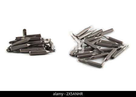 Isolated on a white background tips of a group of phillips head screwdriver bits. Top view. Stock Photo