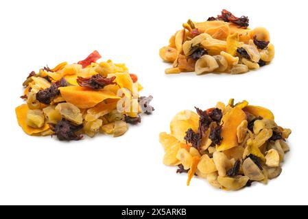 Mix of dried exotic fruit, mangos,slices of pineapples, passion fruit, papaya. Vegetarian dessert. Stock Photo