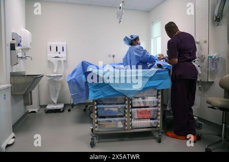 Patient having Peripherally Inserted Central Catheter (Picc Line) Administered under Local Anaesthetic in Hospital Surrey England Stock Photo