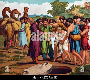 Illustration Joseph being Sold By his Brethren to the Ishmeelites (Genesis) Old Testament from 19th Century Illustrated Family Bible Stock Photo