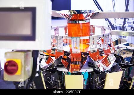 Automatic equipment for weighing, packaging and quality control of food products Stock Photo