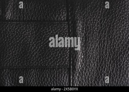 Black leather texture background. Close up of black leather texture. Black leather background Stock Photo